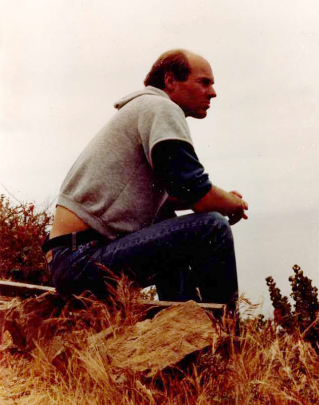 A photo of younger Paul looking out over the Pacific ocean